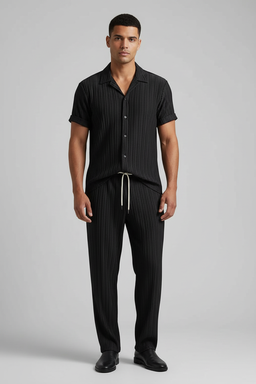 Men's suit in black worn by a model